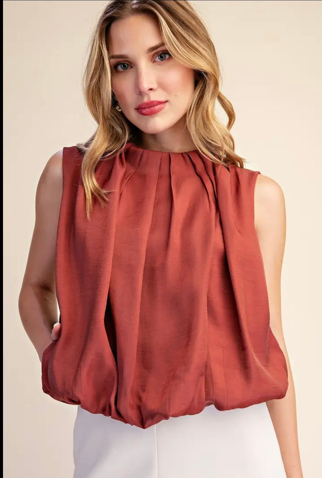 Sleeveless Pleated Balloon Top with Pockets.