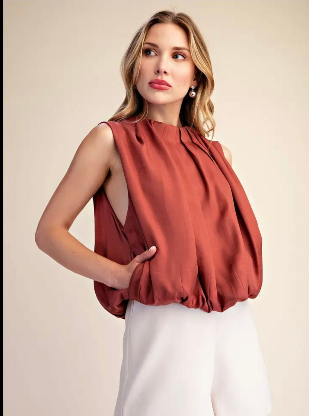 Sleeveless Pleated Balloon Top with Pockets.