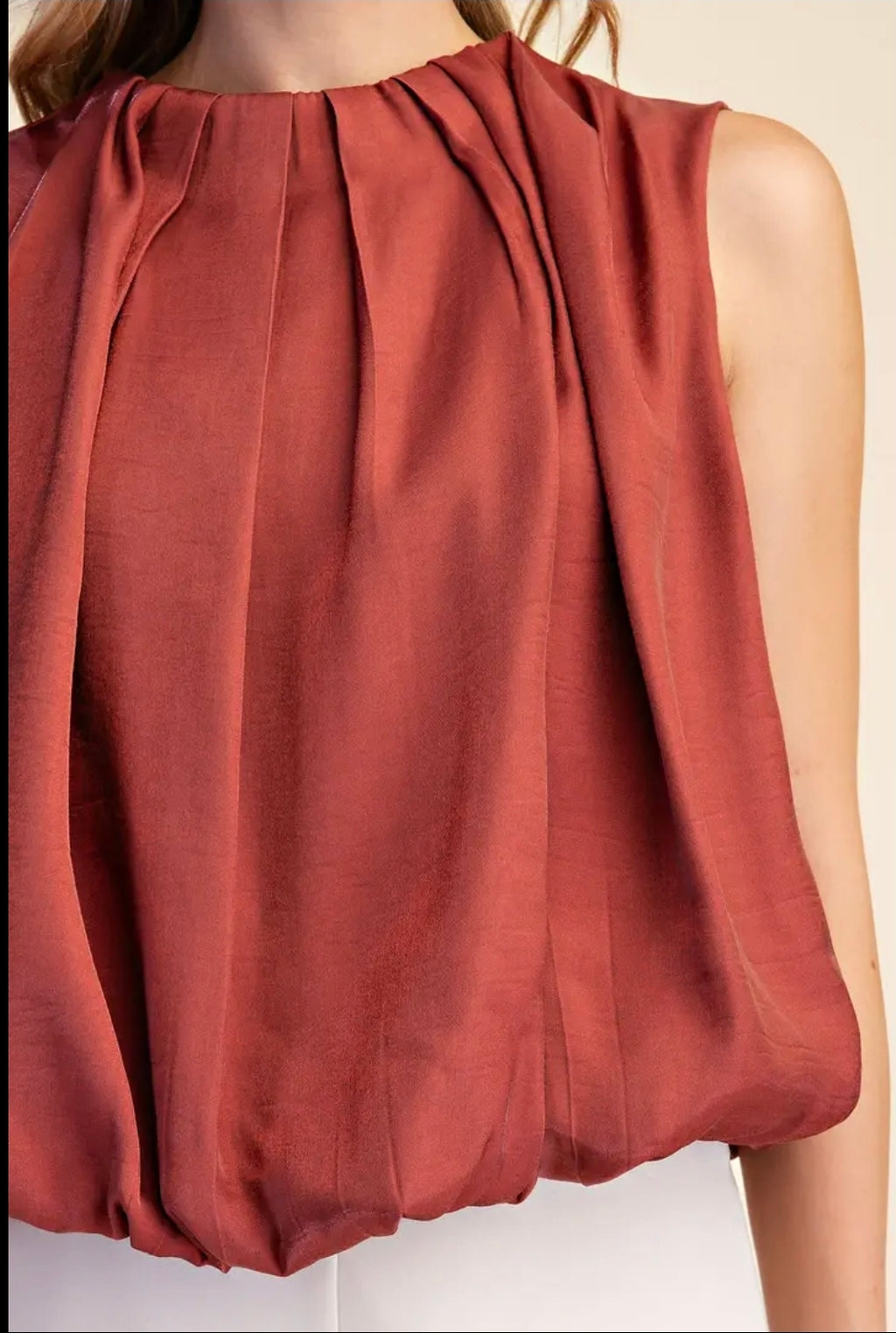 Sleeveless Pleated Balloon Top with Pockets.